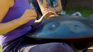 Funnyfuzzy - a person playing the hang drum | Trending HD Video