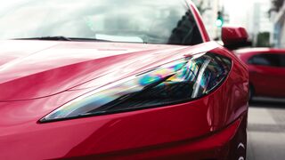 Cartier - sleek red sports car front view in city setting | Trending HD Video