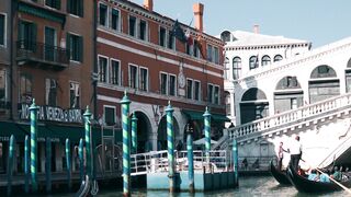 Travel Backpack - a gondola is floating down the canal in venice | Trending HD Video