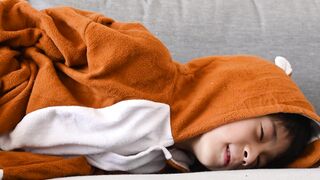 Funnyfuzzy - a boy in a costume rolling on a couch | Trending HD Video