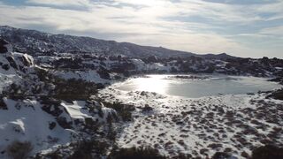 Winterhalter - aerial view of winter mountains and icy lake | Trending HD Video