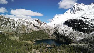 4K Computer Monitor - aerial view of snow capped alpine mountains | Trending HD Video