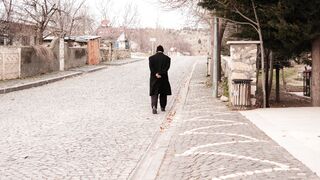 Funnyfuzzy - man walking down quiet cobblestone street | Trending HD Video