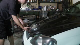 Carrefour - a man checking the oil of a car | Trending HD Video