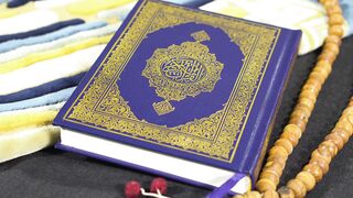 Broken Country Reese s Book Club - close up of the quran holy book and wooden prayer beads | Tr