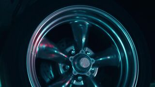 Carpet - a car with a tire on it in a dark room | Trending HD Video
