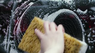 Carpet - person washing black car | Trending HD Video