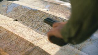 video of a map with gun on top | Professional HD Video