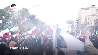 Video shows airstrike hitting Iran as thousands celebrate Quds Day.