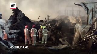 AP reporter shows scene in Holon after missile strikes site in Israel