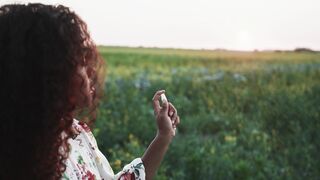 The Bold and the Beautiful - a woman spraying perfume on a field | Trending HD Video