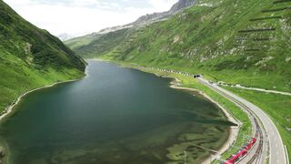 4K Computer Monitor - scenic aerial view over swiss alpine lake | Trending HD Video