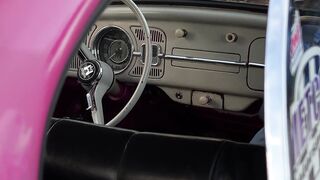 Scarred - close up of a pink volkswagen beetle | Trending HD Video