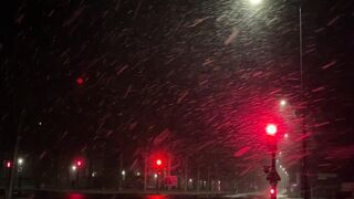Winter solstice - snowy night street scene with traffic lights | Trending HD Video