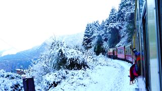 Travelon - train traveling on the mountainside in winter | Trending HD Video