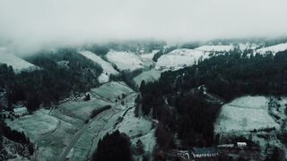 4K Computer Monitor - aerial view of a snowy landscape with fog | Trending HD Video