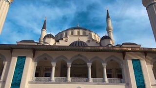 the blue sky is reflected in the white walls of a mosque | Professional HD Video