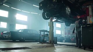 Notes on Being a Man - a man standing in a garage with a car | Trending HD Video