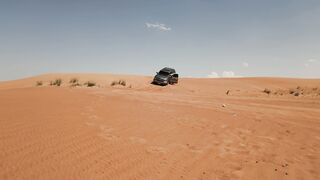 4K Computer Monitor - a car is driving through the desert | Trending HD Video