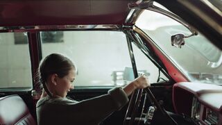 Woman - a woman sitting in the driver s seat of a car | Trending HD Video