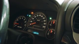 Scarred - closeup of illuminated car dashboard gauges | Trending HD Video