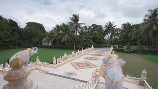 4K Computer Monitor - aerial view of hindu temple with lush surroundings | Trending HD Video