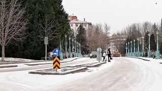 Winter solstice - snowy urban street with light traffic in winter | Trending HD Video