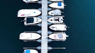 4K resolution - aerial view of boats docked in swedish harbor | Trending HD Video