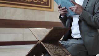 man united vs aston villa - a man reading the koran | Trending HD Video