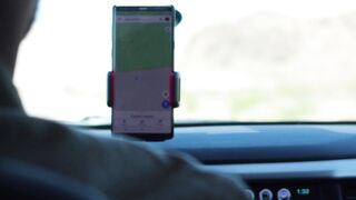 Carrefour - person using an application on his phone for guidance while driving | Trending HD V