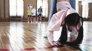 Sports - man teaching the girl to do headstand | Trending HD Video