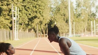 Sports - man guiding her to do sit ups | Trending HD Video