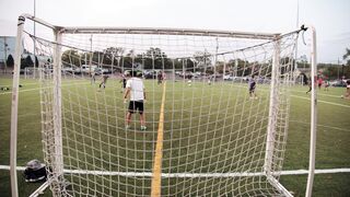 Sports - a goalie guarding the net in a game of football | Trending HD Video