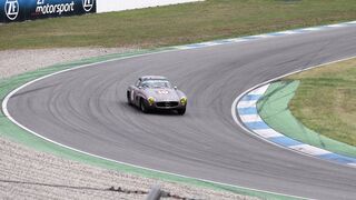 Cartier - vintage racecar driving along speedway | Trending HD Video