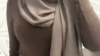 A HIJABI WOMAN DANCING