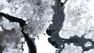4K Computer Monitor - aerial view of ice and water formations in winter | Trending HD Video