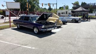 Carrefour - a purple car with its hood open in a parking lot | Trending HD Video