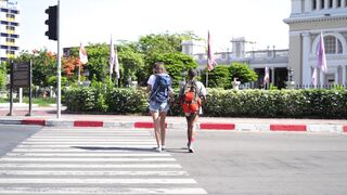 Travelon - female backpackers crossing a road | Trending HD Video
