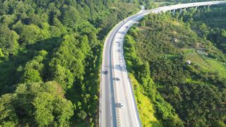 4K resolution - aerial view of scenic forest highway road | Trending HD Video