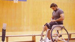 Notes on Being a Man - a man removing the belt from his wheelchair | Trending HD Video