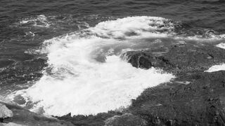 4K resolution - monochrome ocean waves crashing on rocks | Trending HD Video