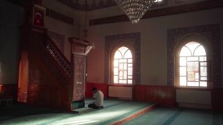 Notes on Being a Man - a man sits in a mosque with a window | Trending HD Video