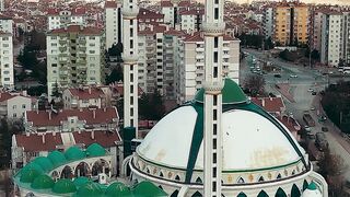 an aerial view of a mosque in a city | Professional HD Video