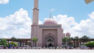 a large pink mosque with a large clock tower | Professional HD Video