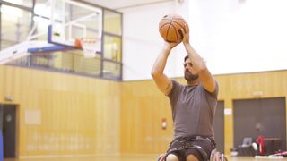 Sports - a man on a wheelchair playing basketball | Trending HD Video