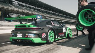 Sportsgirl - crew replacing tires of race car | Trending HD Video