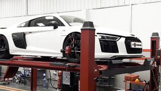 Sport Bike - luxury sports car on vehicle lift in garage | Trending HD Video