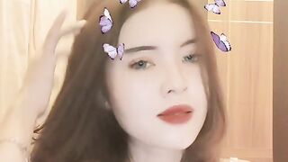 Beautiful Girl with Butterfly Filter Posing to Catchy Indonesian Song