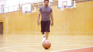 Notes on Being a Man - man taking basketball from courtyard | Trending HD Video