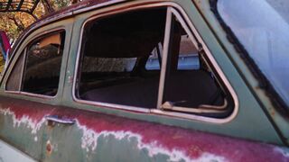 Electric car - vintage rusted car in outdoor setting | Trending HD Video